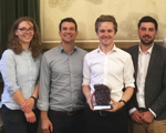 Five Early Career award winners standing in front of the William Smith map at Burlington House