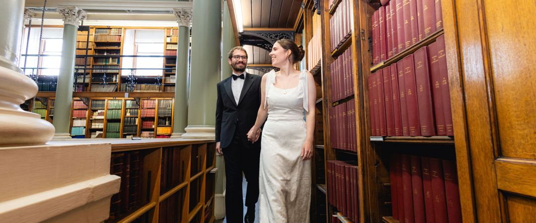 The bride and groom were wandering around the Upper Library.