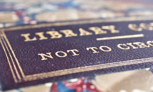 A close of of a marbled book cover with the words Library copy Not to Circulate