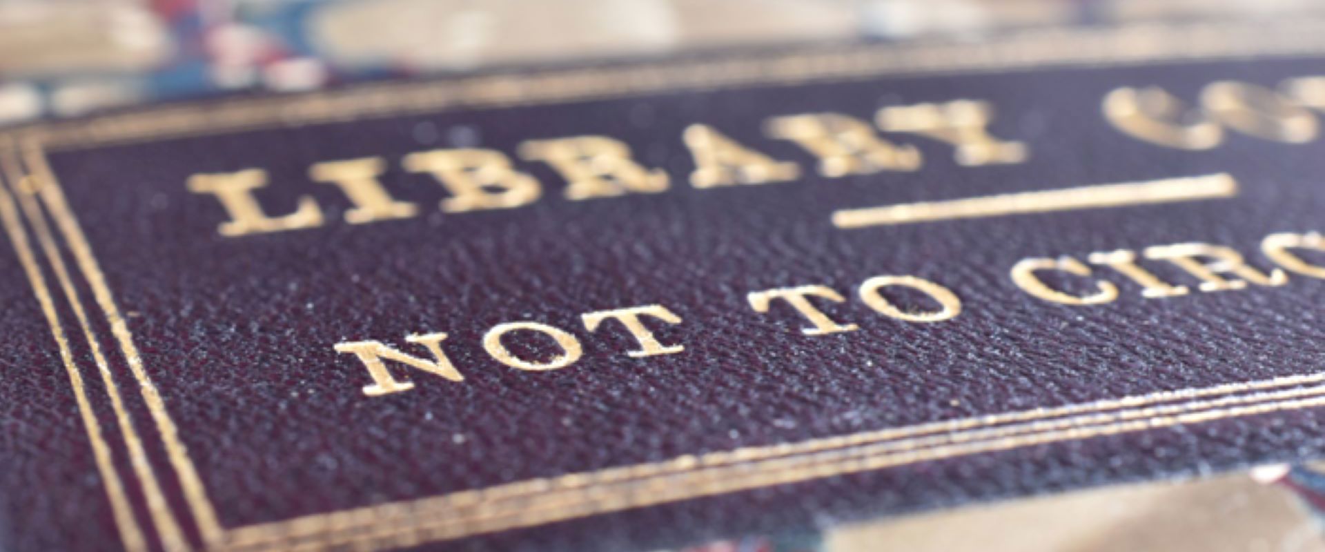 A close of of a marbled book cover with the words Library copy Not to Circulate