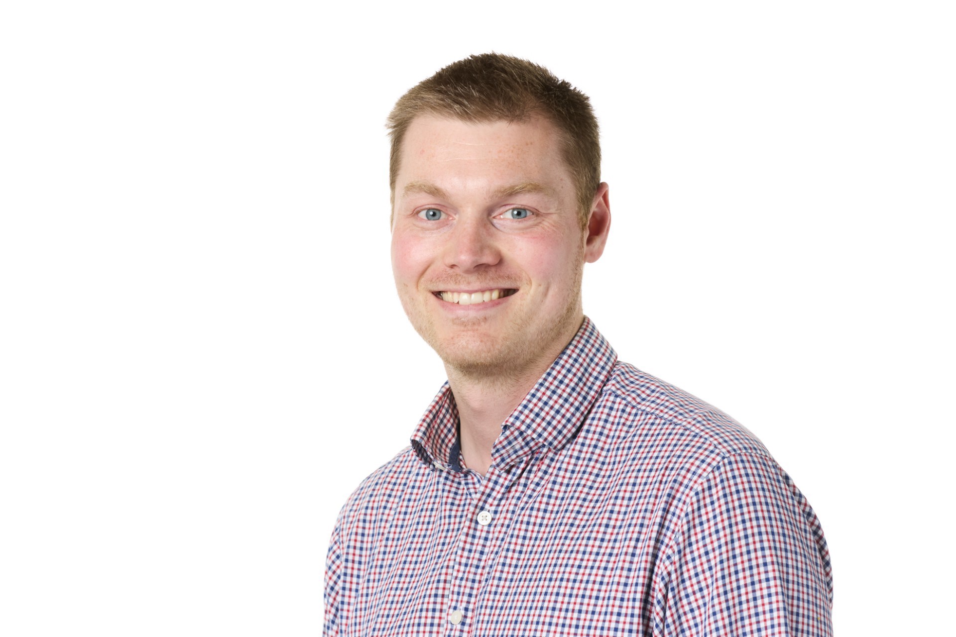 Professional photo of a personal in front of a plain background