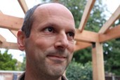 white man with very short receding hair smiling