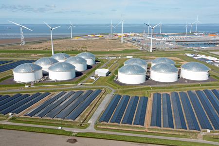 Aerial from industry in the Eemshaven Delftzijl in the Netherlands with wind turbines