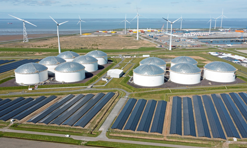 Aerial from industry in the Eemshaven Delftzijl in the Netherlands with wind turbines