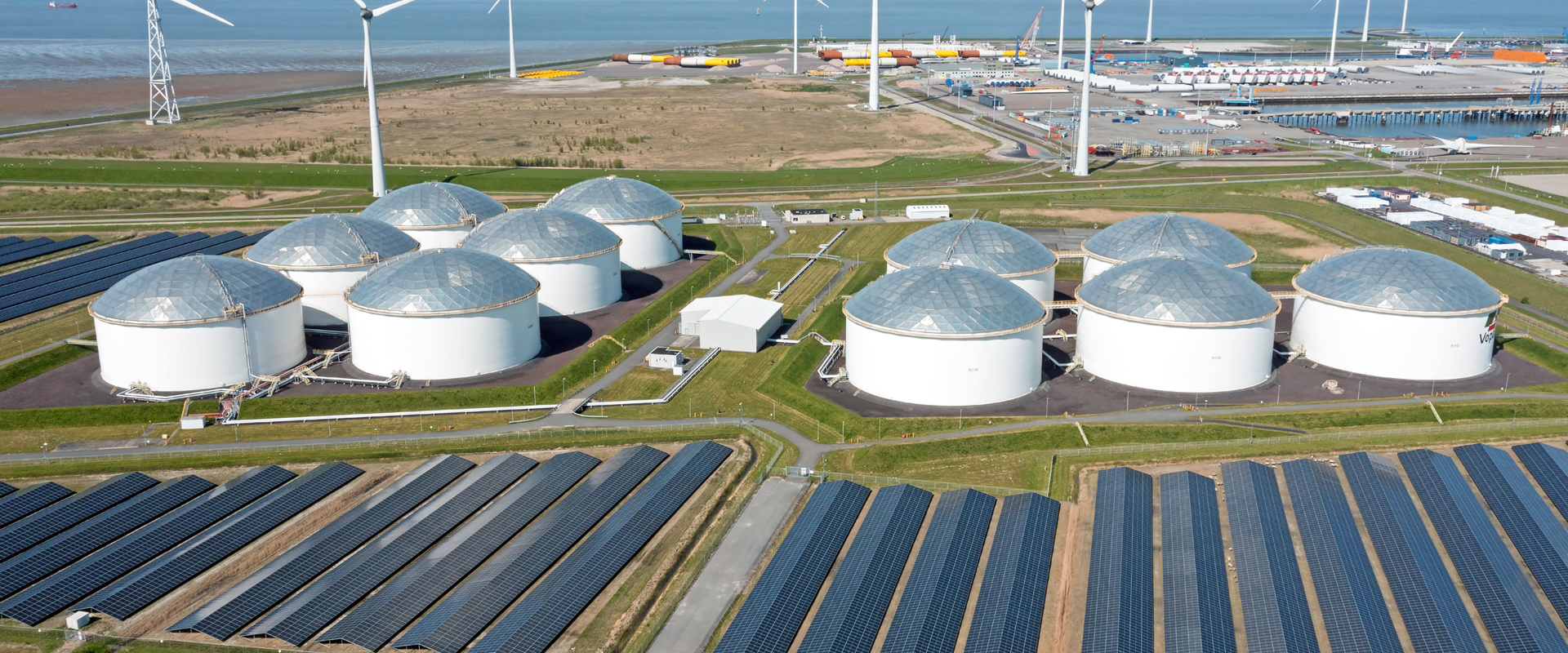 Aerial from industry in the Eemshaven Delftzijl in the Netherlands with wind turbines