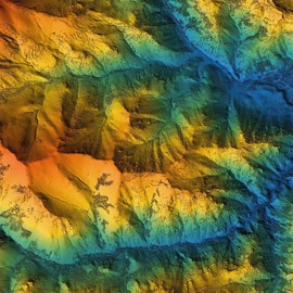 view of mountain range in various colours from above