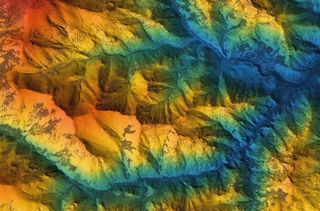view of mountain range in various colours from above