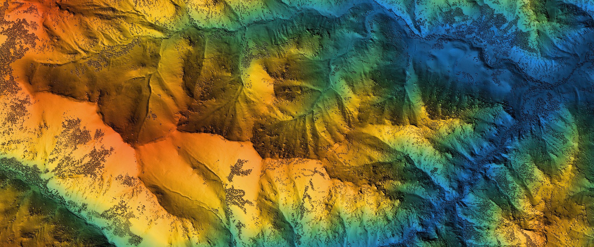 view of mountain range in various colours from above