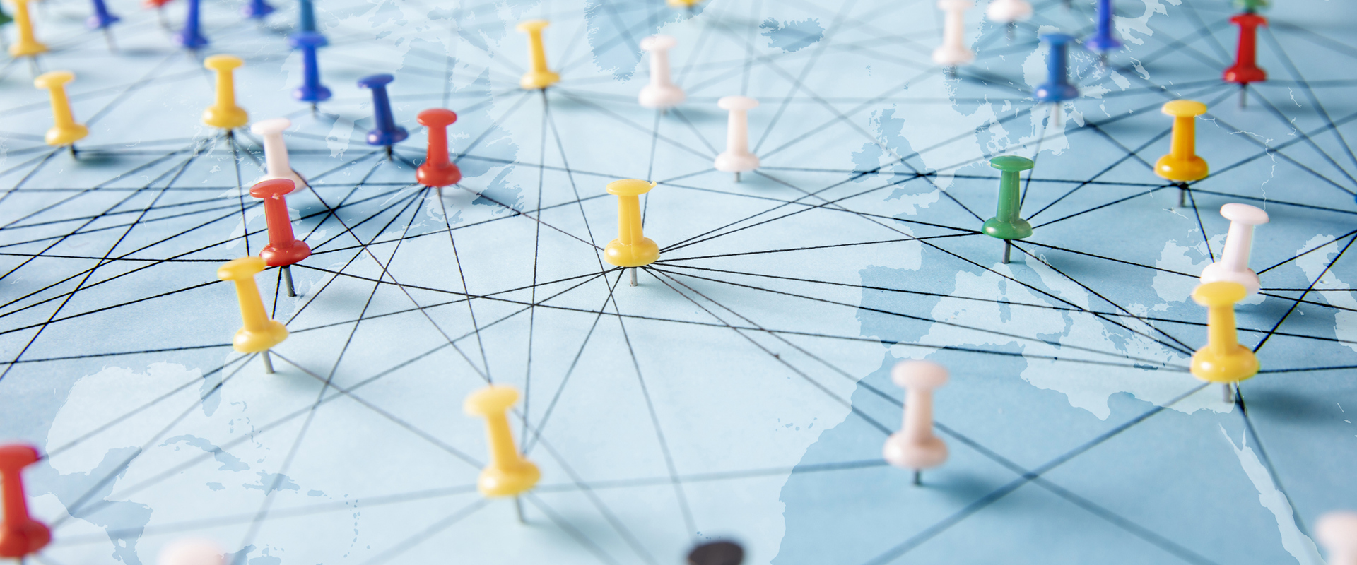 coloured pins on a map with lines joining them