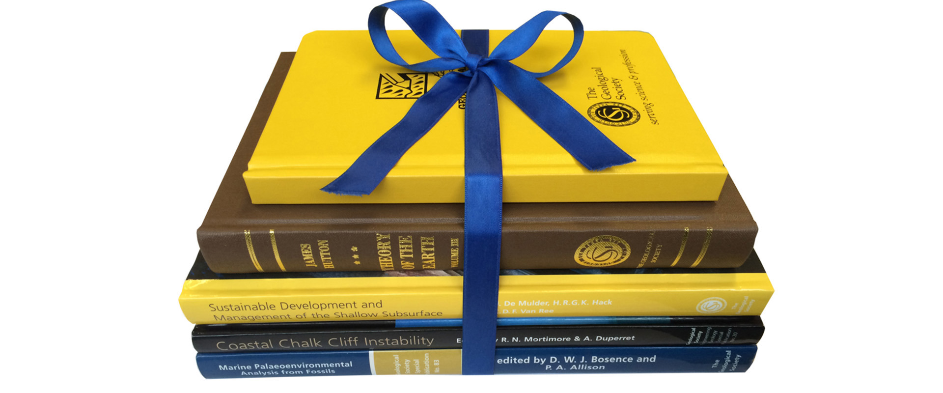 A pile of publications from the Geological Society and other publishers tied with a blue ribbon.