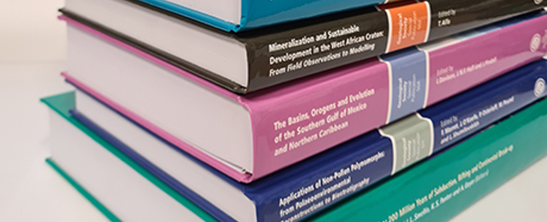 Pile of Special Publication books against a white background