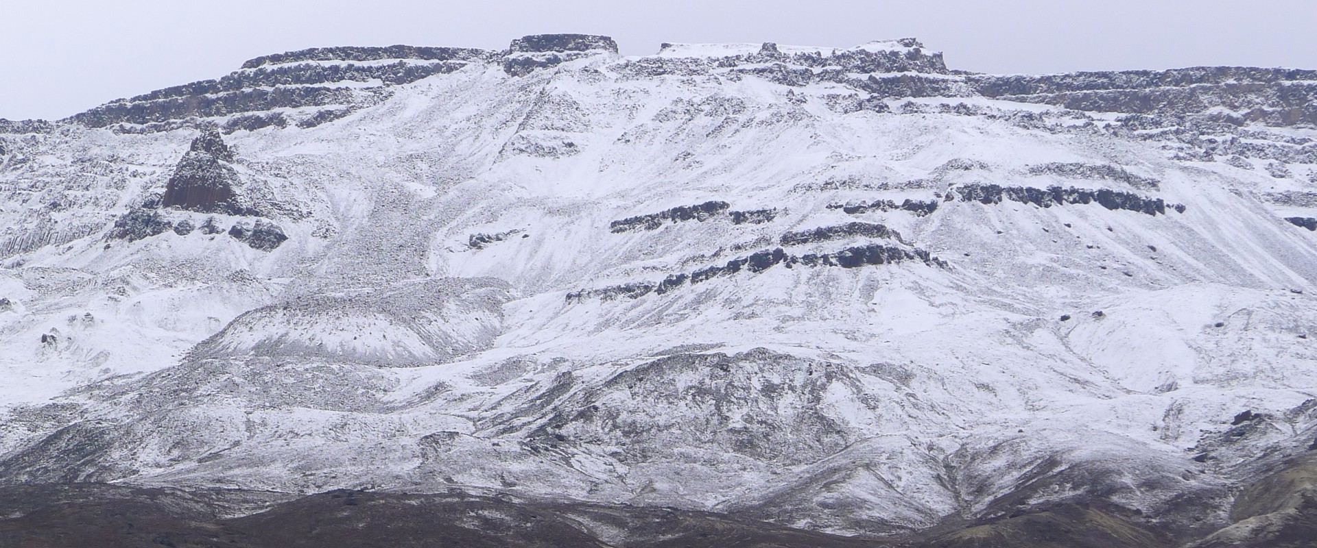 Mountain with snowy areas. 