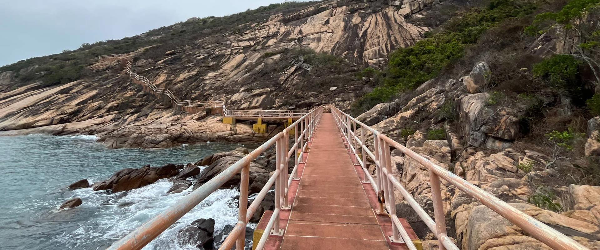 Trails walk and bridge along the rocky coastal line