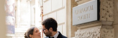 The Bride and the Groom were posing at the entrance of the Geological Society.