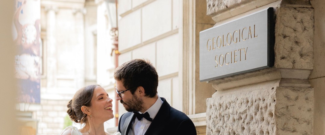 The Bride and the Groom were posing at the entrance of the Geological Society.