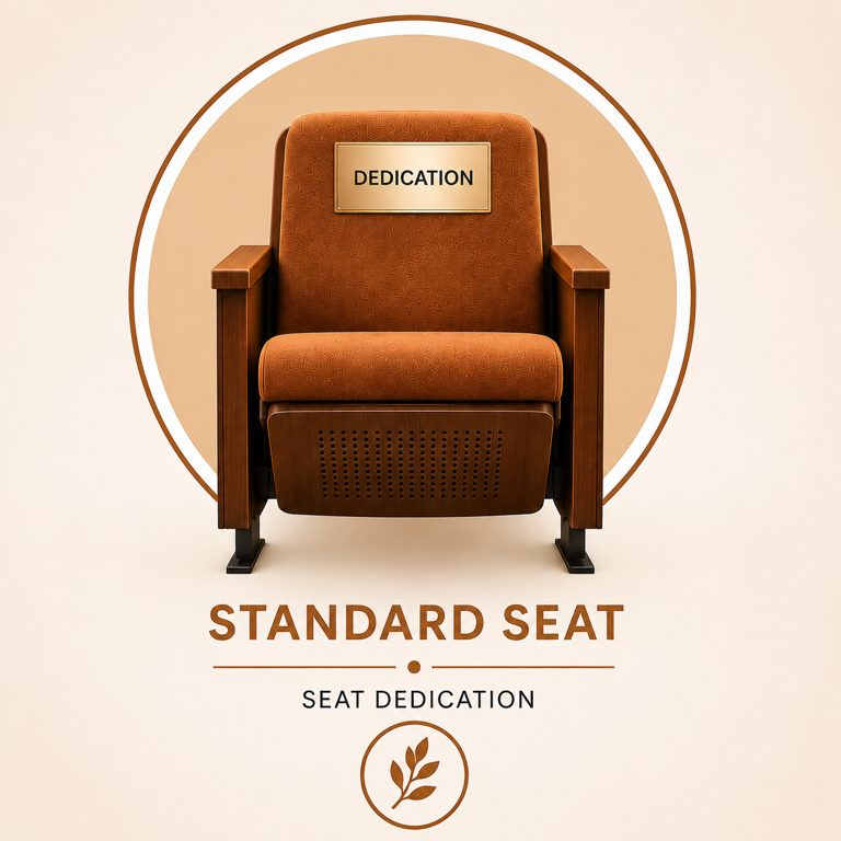 A brown armchair with dedication written on a plaque on it and the words standard seat seat dedication just below it