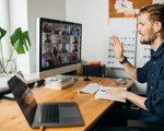 Man in Zoom call with calendar in the background