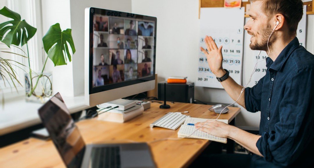 Man in Zoom call with calendar in the background