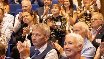 Members of the audience at a Geological Society Awards ceremony clapping