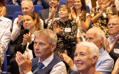 Members of the audience at a Geological Society Awards ceremony clapping