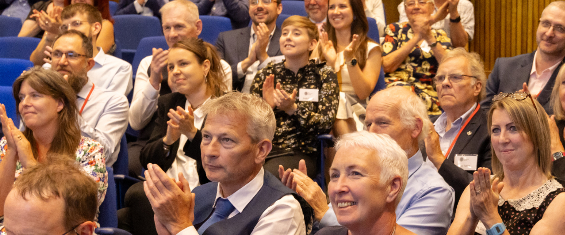 Members of the audience at a Geological Society Awards ceremony clapping