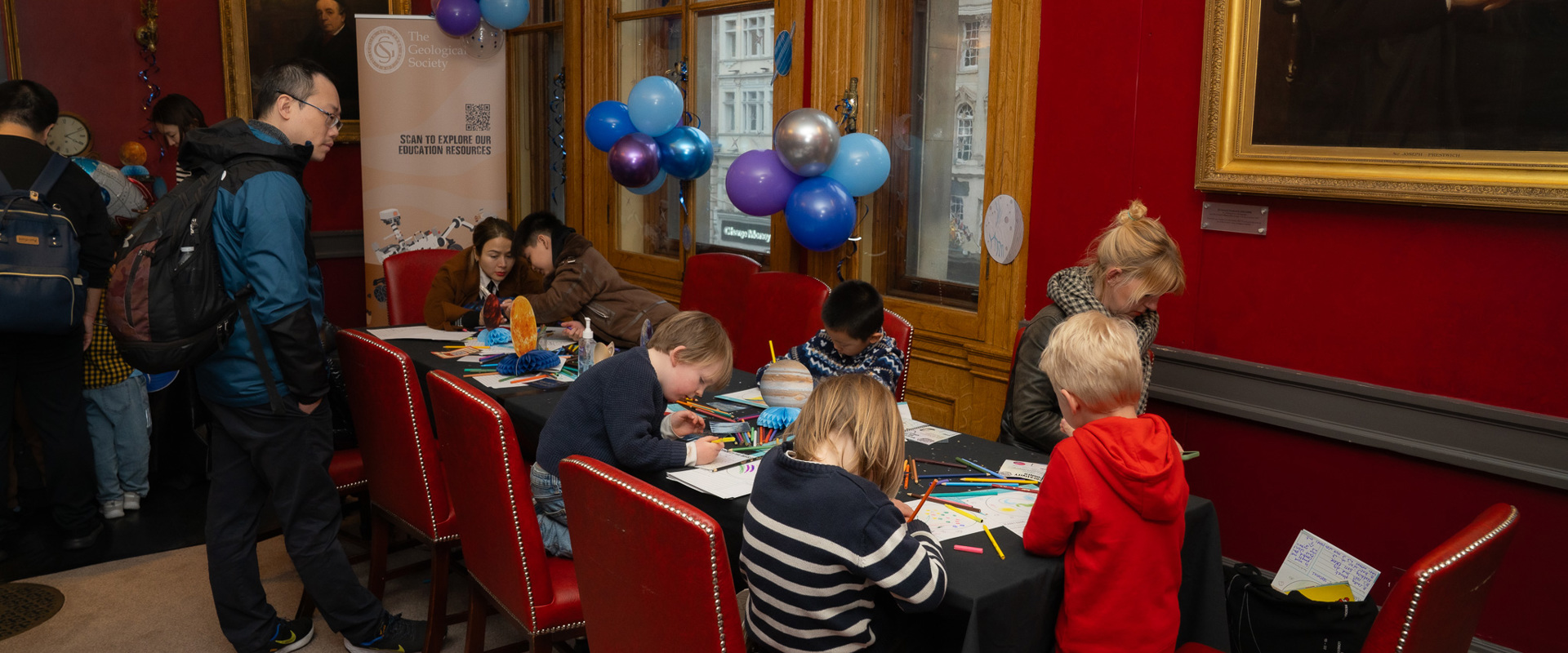 group of small children painting at a table