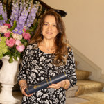 Prof Silvia Peppoloni, Distinguished Service Award recipient, holds a certificate tube