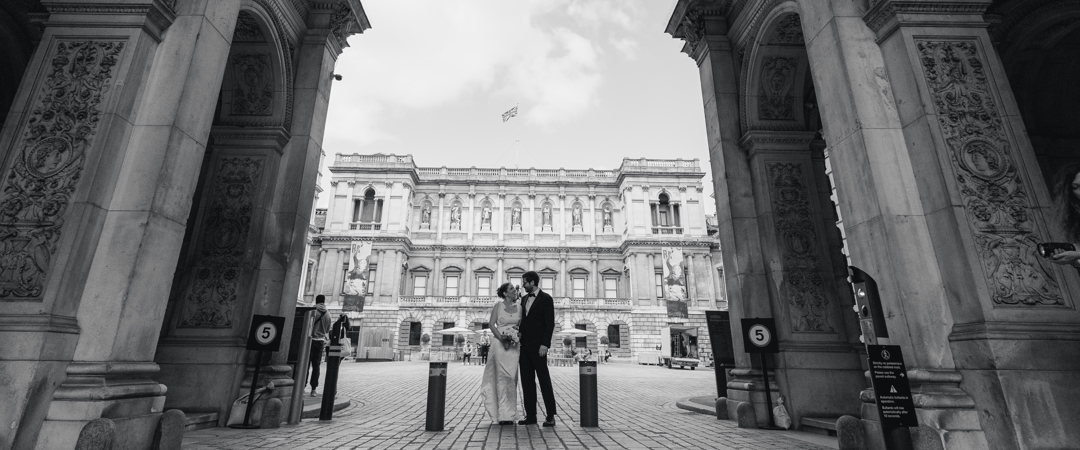 The Bride and the Groom were posing at the Burlington House Courtyard.
