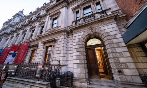 period building with large open wooden doors with geological society placard above them