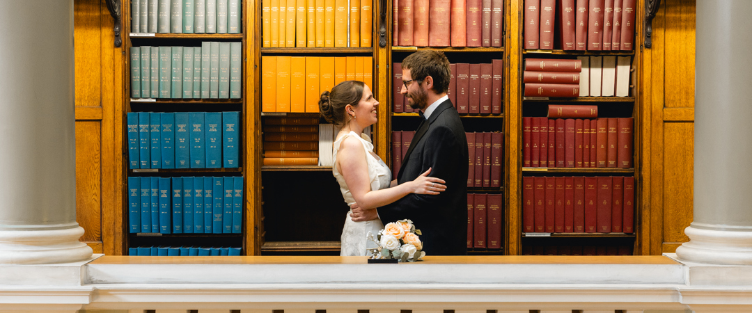 The Bride and groom were posing at the Upper Library.