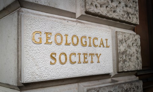 geological society written on a stone plaque