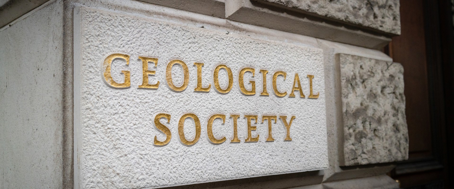 geological society written on a stone plaque