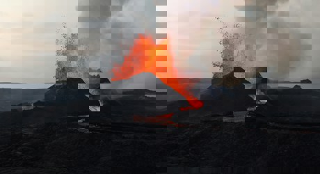 a volcano with lava spurting out