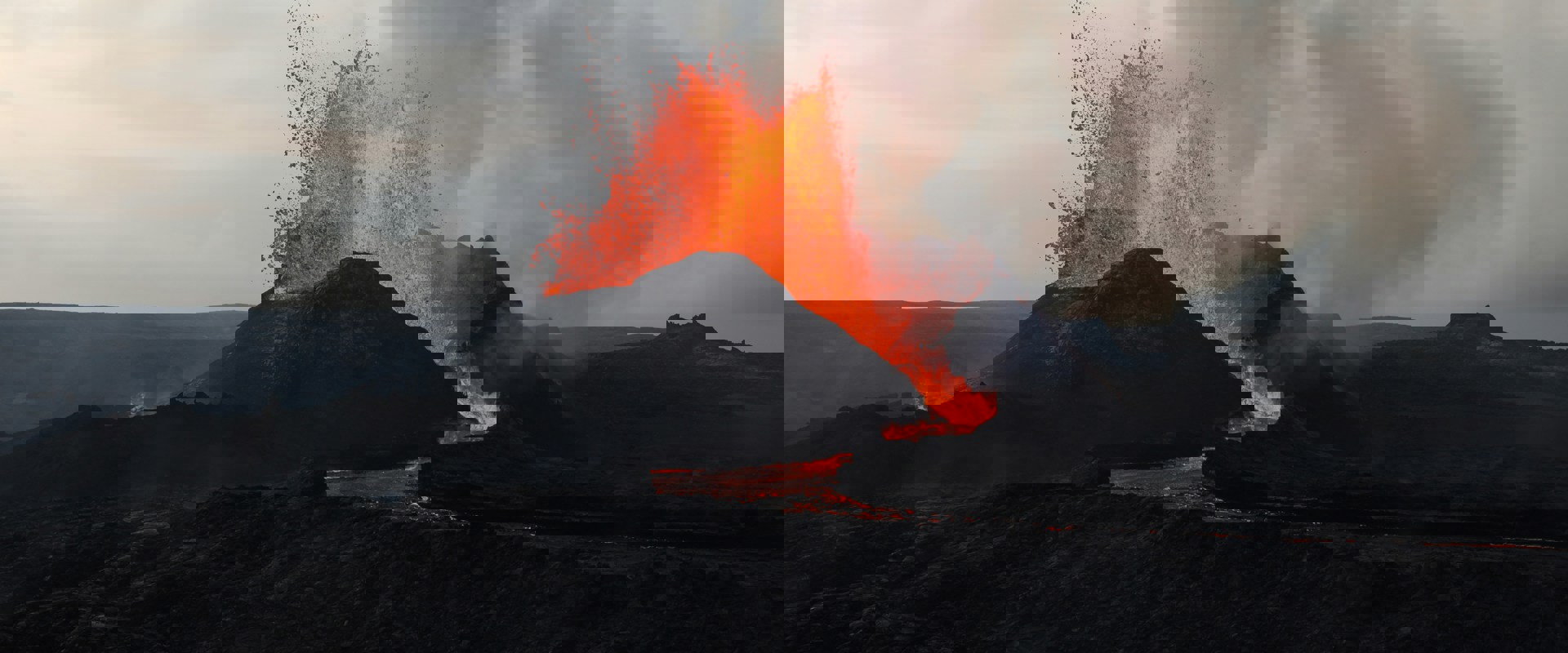 a volcano with lava spurting out